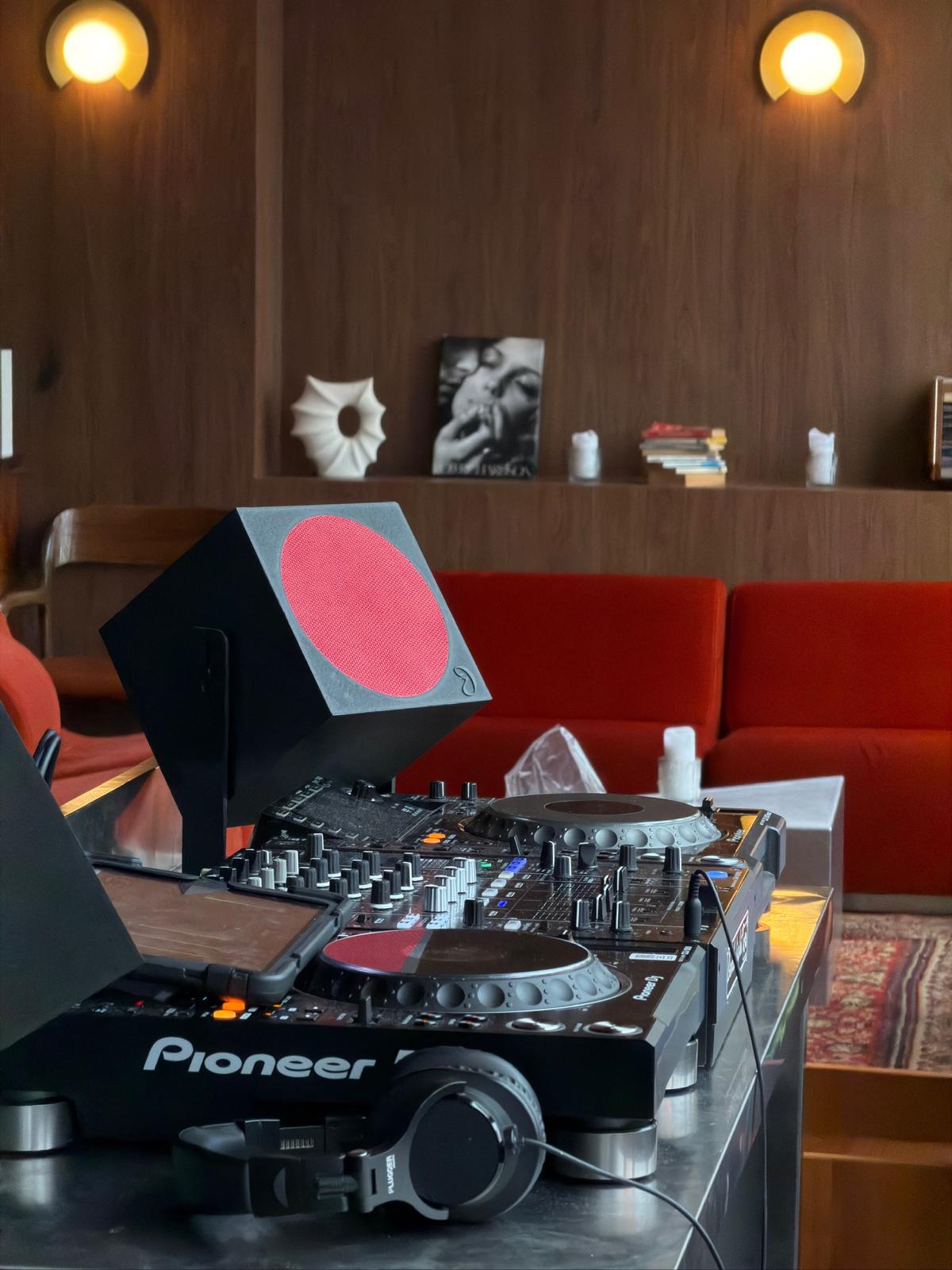 Dimora — custom red-finish DJ monitors in an Italian restaurant